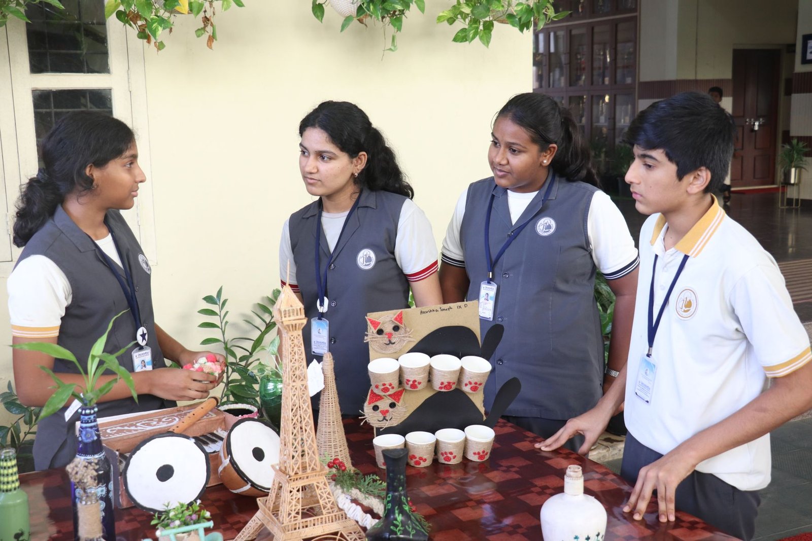 Students presenting their eco-friendly creations