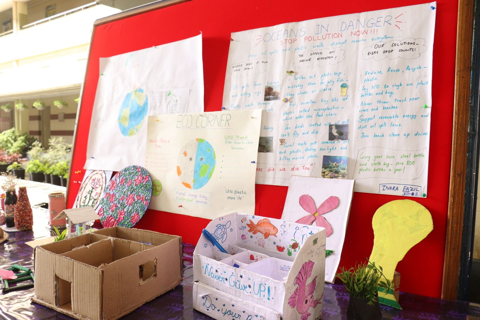 Eco Corner display with student environmental posters and creative projects